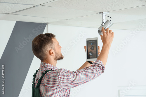 Male worker with tablet com...