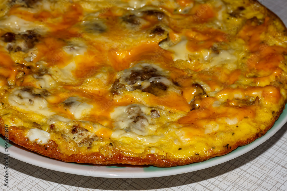 Omelette with meat and cheese for breakfast Omelette with meat and cheese for breakfast