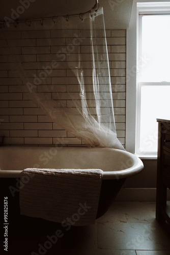 Large white claw foot tub in beachouse rental in South Haven Michigan photo