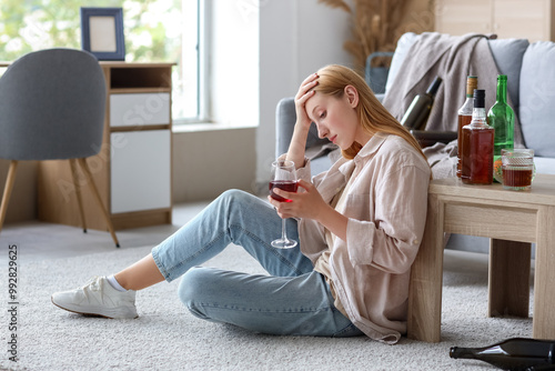 Young woman drinking alcoho...