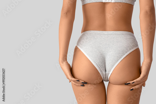 Young woman in underwear wi...