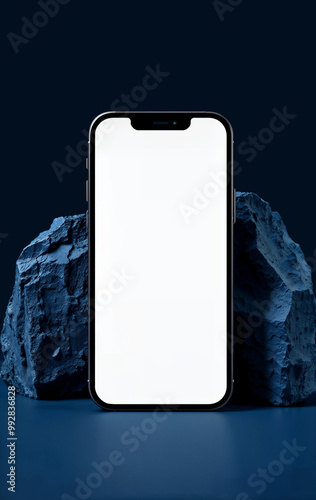 Mobile phone with white screen, muckup design cellphone device on stones blue background beautiful scene social media