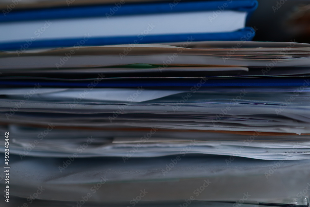 Stack of magazines, books, papers in the office. Stack of magazines, books, papers in the office.