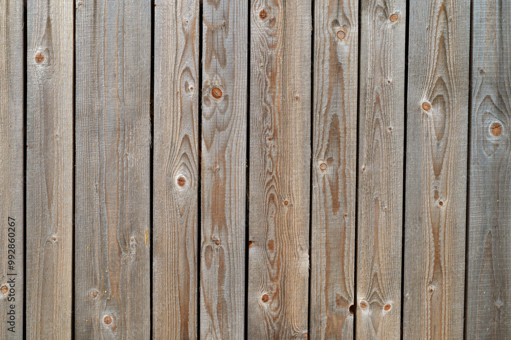 Wooden shield made of fresh sawn pine boards as a background. Beautiful wood texture. Wooden shield made of fresh sawn pine boards as a background. Beautiful wood texture.