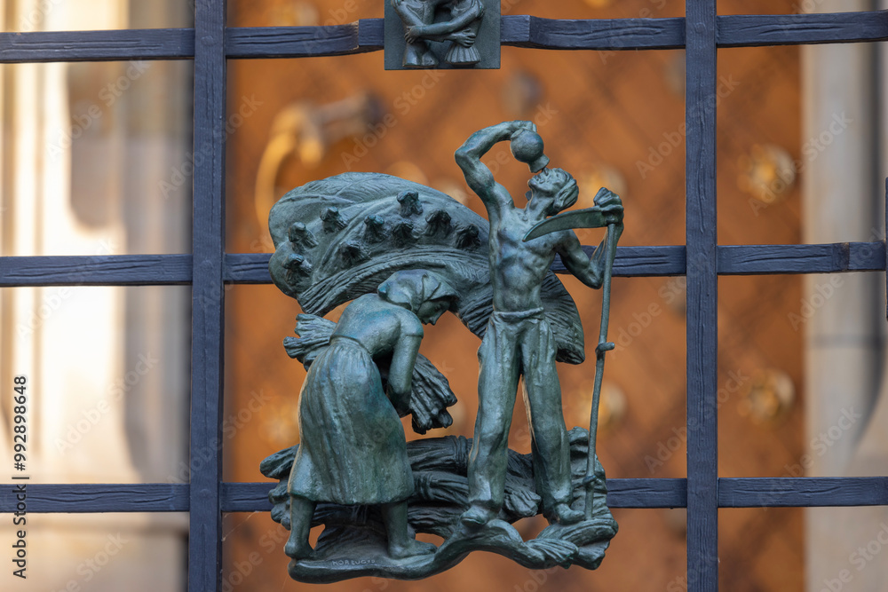 Figurines on metal fence of the Golden Gate of medieval St. Vitus Cathedral, Prague, Czech Republic