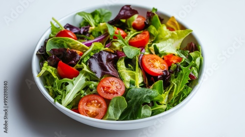 Wallpaper Mural A fresh vegetable salad featuring mixed greens, cherry tomatoes, and leafy vegetables served in a white bowl on a white background. Torontodigital.ca