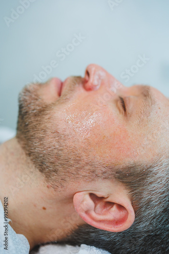 Male cosmetology in a beauty salon. A man takes care of his facial skin.