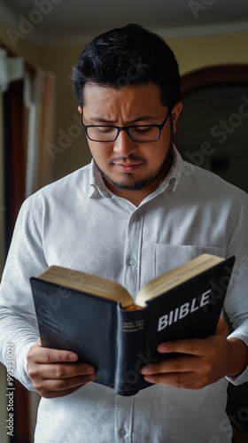 Learned man reading a Bible in a bright, spacious room