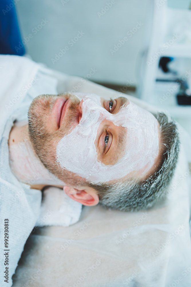 The man is at the dermatologist's appointment. Male cosmetology. Masks for men in a cosmetology clinic. The man is at the dermatologist's appointment. Male cosmetology. Masks for men in a cosmetology clinic.