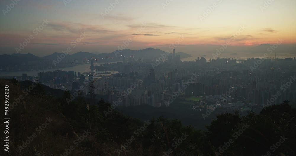 Hillside Peak View over Hong Kong Kowloon City Skyline with Highrise Buildings during Sunset Hillside Peak View over Hong Kong Kowloon City Skyline with Highrise Buildings during Sunset