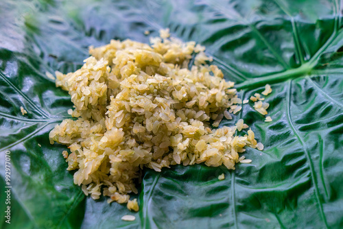 Green sticky rice (Com Xanh) wrapped in lotus leaves, very fragrant and sticky - a famous traditional dish of Hanoi people. photo