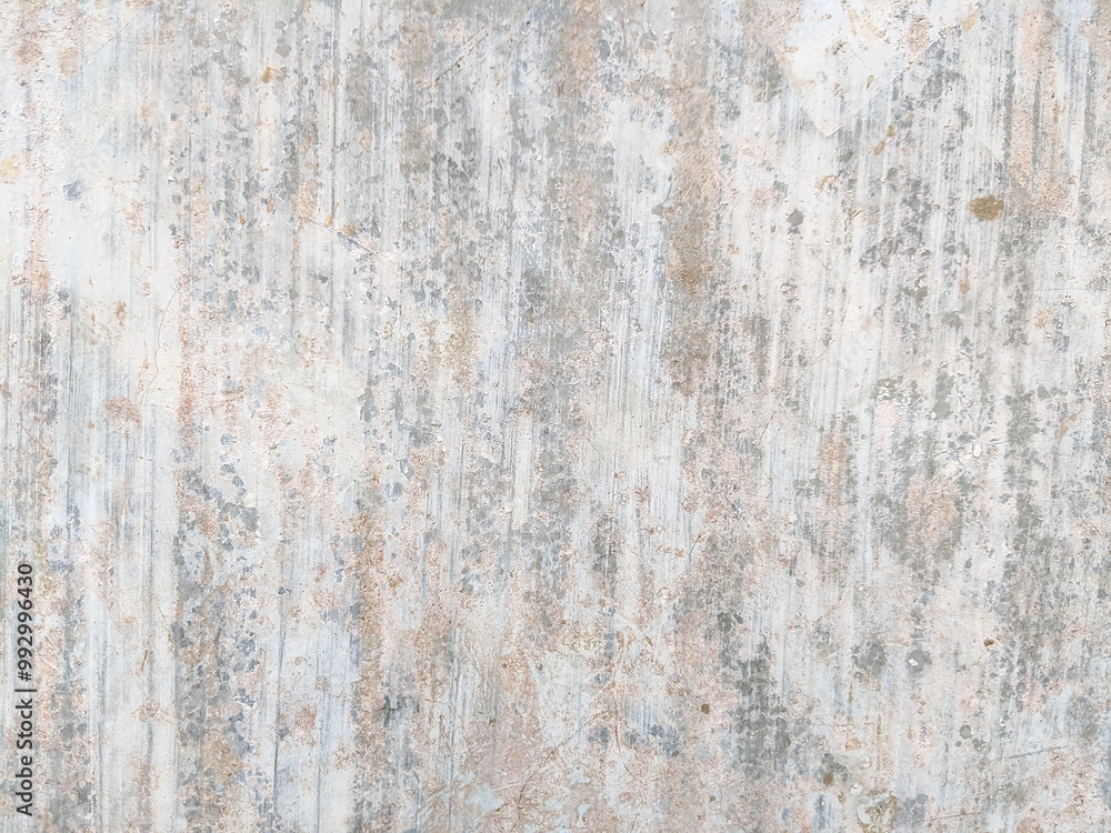 Weathered surface with vertical streaks and faded spots in light gray and beige tones. The textured wall showcases signs of aging, roughness, and subtle color variations in an abstract pattern. Weathered surface with vertical streaks and faded spots in light gray and beige tones. The textured wall showcases signs of aging, roughness, and subtle color variations in an abstract pattern.