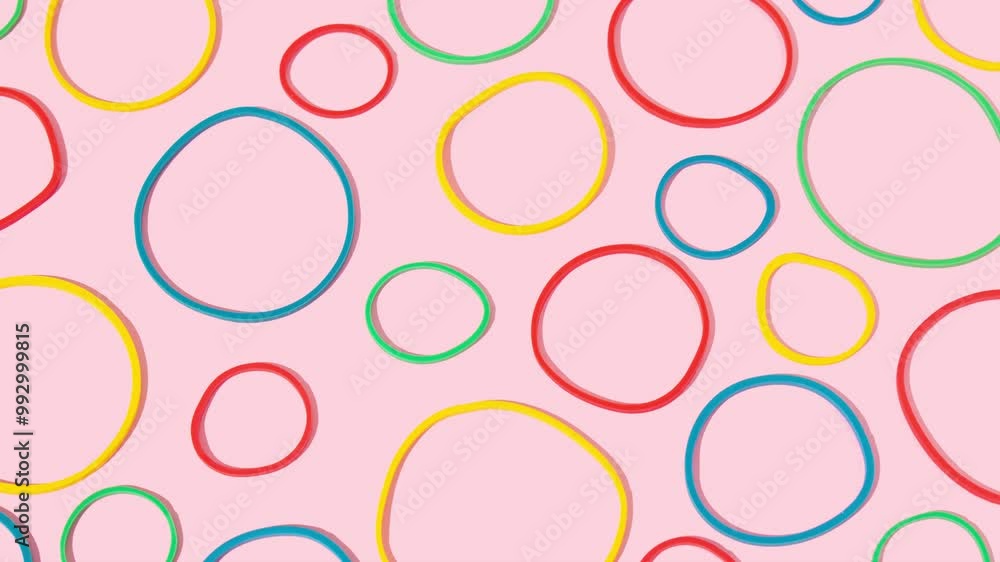 Colourful rubber bands on bright pink background. Minimal concept. Seamless pattern. Colourful rubber bands on bright pink background. Minimal concept. Seamless pattern.