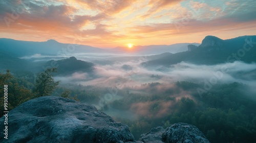 hazy panorama of the landscape. Wonderfully surreal dawn on rugged peaks, offering a glimpse of the foggy valley beneath. cloud cover above the forest. A view of the fanciful countryside below. 