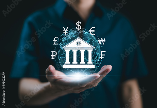 Digital Banking and Global Financial Technology Concept. Digital bank icon has various currency symbols, symbolizing digital banking and global financial transactions. fintech, international finance,