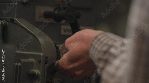 Loading a 35mm film projector