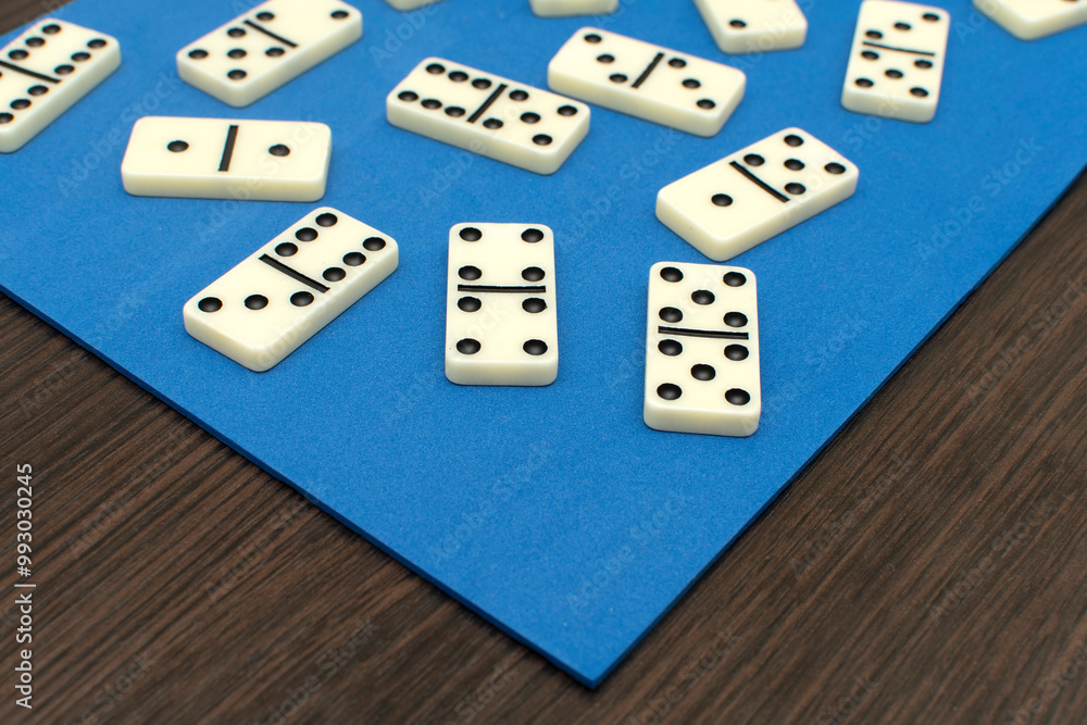 Dominoes bones on blue background Dominoes bones on blue background