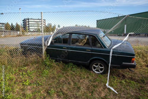 car crashed through chain-link fence