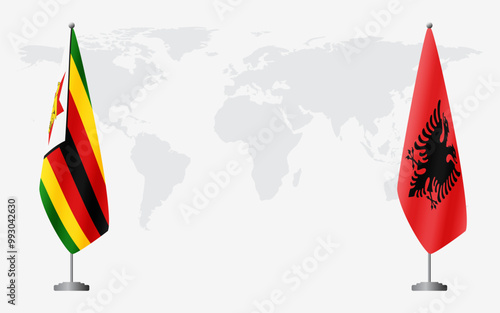 Zimbabwe and Albania flags for official meeting against background of world map.