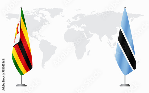 Zimbabwe and Botswana flags for official meeting against background of world map.