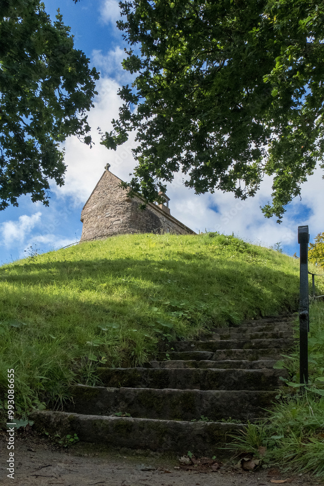 Low angle view of La Hougue Bie dolmen. A 16th–century neolithic christian chapel. Low angle view of La Hougue Bie dolmen. A 16th–century neolithic christian chapel.