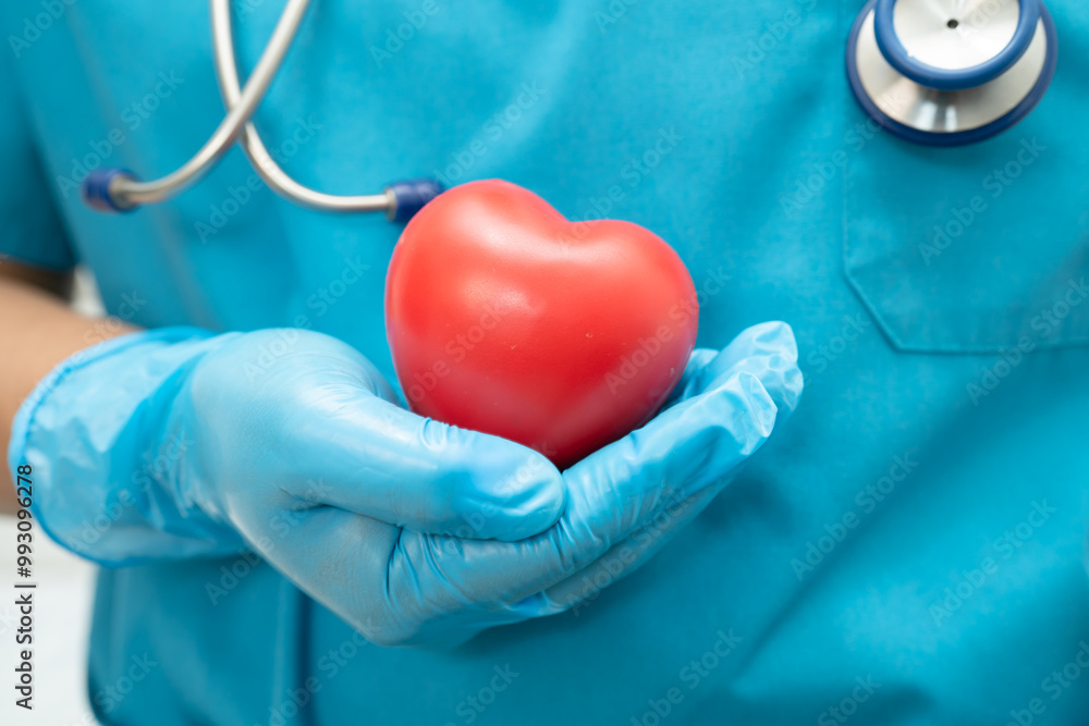 Φωτογραφία Doctor holding a red heart in hospital ward, healthy strong medical concept