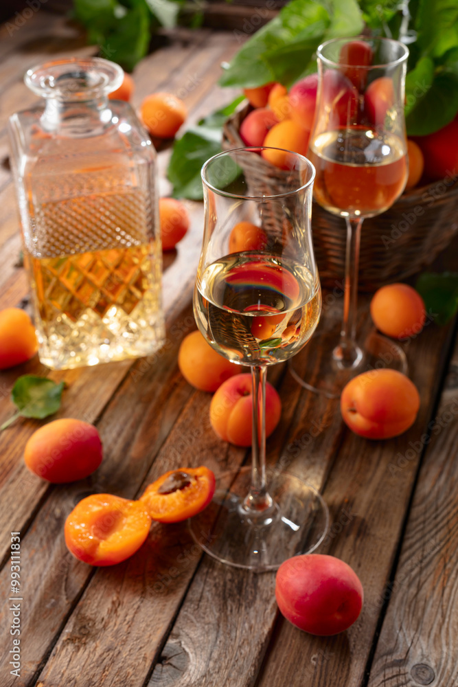 Apricot liqueur or grappa and fresh apricots. Apricot liqueur or grappa and fresh apricots.