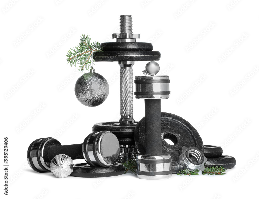 Dumbbells and Christmas decor isolated on white Dumbbells and Christmas decor isolated on white