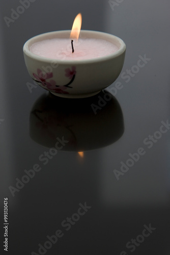 Burning pink tea light
 photo