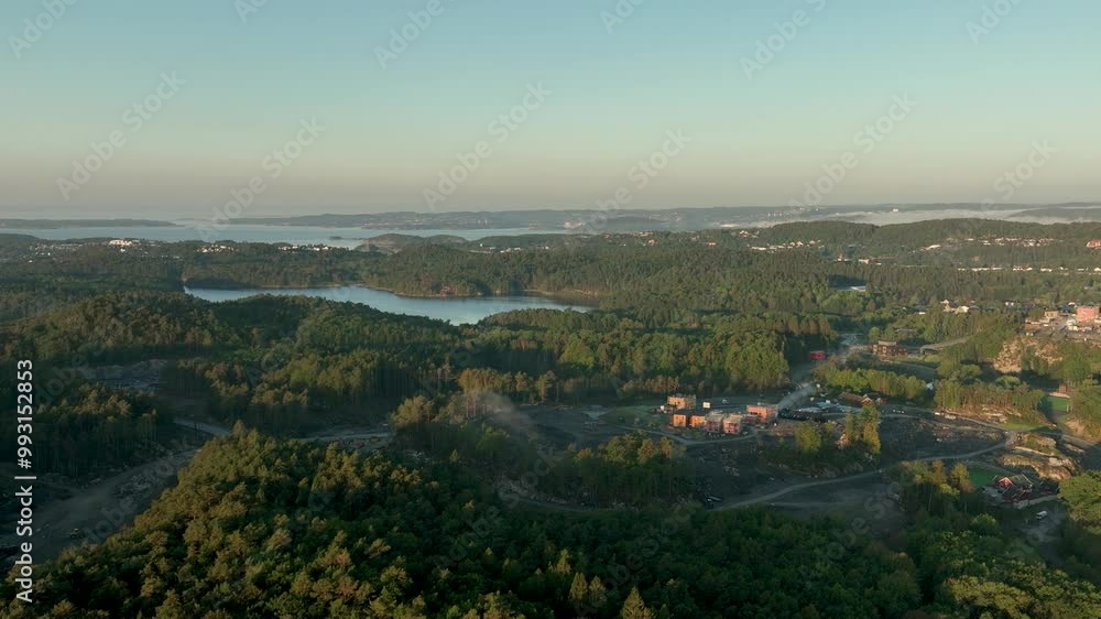 Aerial view of sunrise, fog, and modern homes being built. Aerial view of sunrise, fog, and modern homes being built.