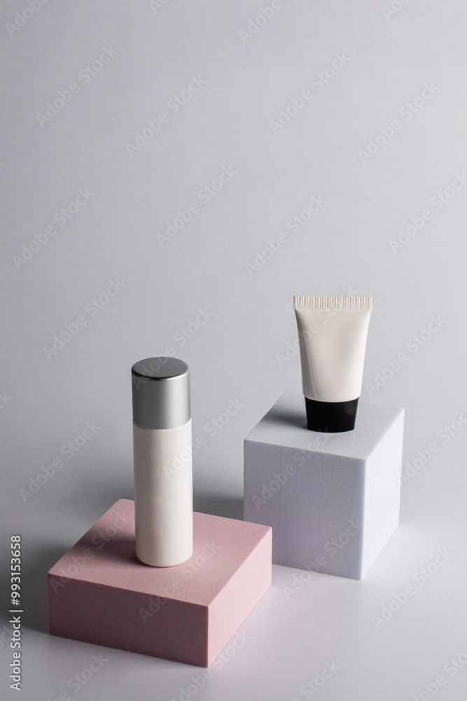 Plastic white tube for cream or lotion. Skin care or sunscreen cosmetic with stylish props on cream background. Plastic white tube for cream or lotion. Skin care or sunscreen cosmetic with stylish props on cream background.