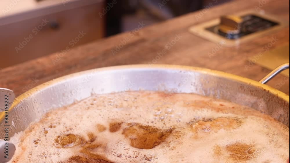 Traditional Austrian wiener schnitzel in hot oil Traditional Austrian wiener schnitzel in hot oil