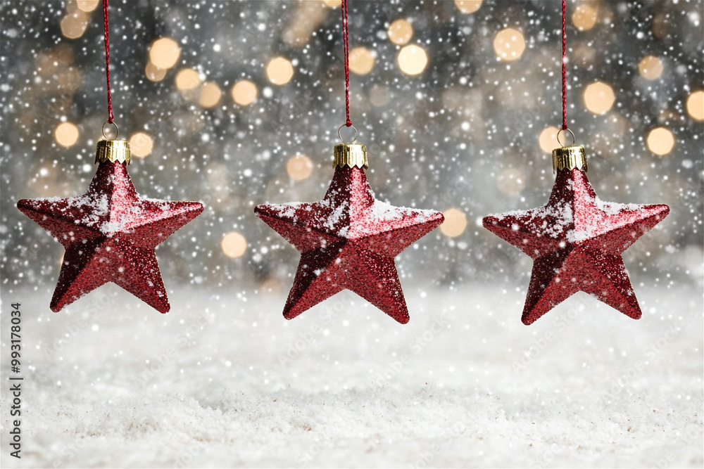 Three red glitter star ornaments hanging with a snowy background and blurry lights, perfect for christmas Three red glitter star ornaments hanging with a snowy background and blurry lights, perfect for christmas