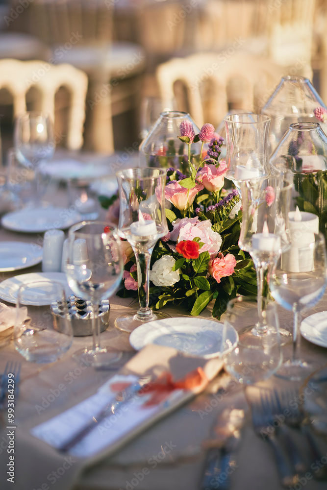 Elegant Waterfront Outdoor Wedding Reception with Draped Canopy, Floral Centerpieces, and White Chairs at a Luxurious Seaside Venue Elegant Waterfront Outdoor Wedding Reception with Draped Canopy, Floral Centerpieces, and White Chairs at a Luxurious Seaside Venue