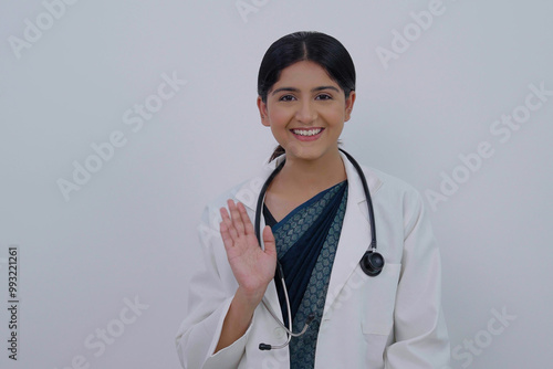 Canvastavla Indian Female Doctor Waving Hello, Hi