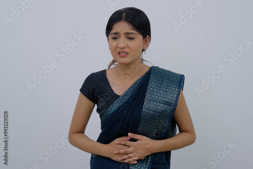 Indian Woman in Saree having Stomach Ache