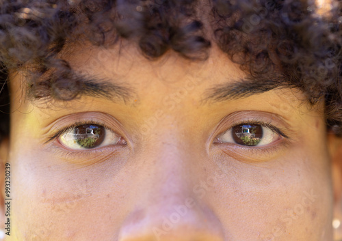 Close-up of man's eyes with outdoor reflection, capturing natural beauty photo