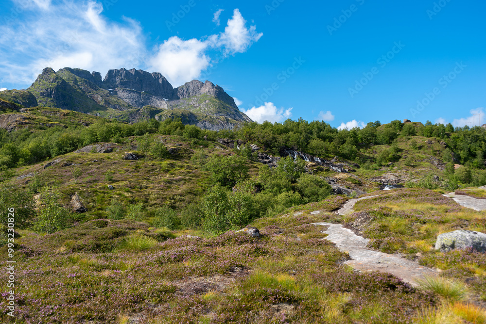 Landscape with Sorvagen waterfall near Munkebu-stig. Sorvagen in Lofoten district of Norway Landscape with Sorvagen waterfall near Munkebu-stig. Sorvagen in Lofoten district of Norway