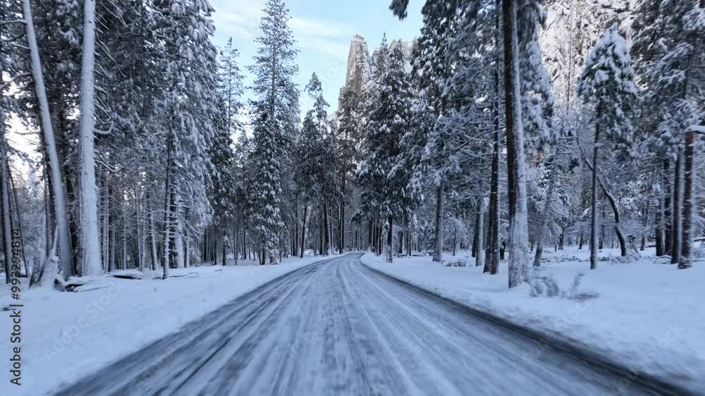 Driving through Yosemite Valley during a snowy winter in Yosemite National Park, California. Driving through Yosemite Valley during a snowy winter in Yosemite National Park, California.