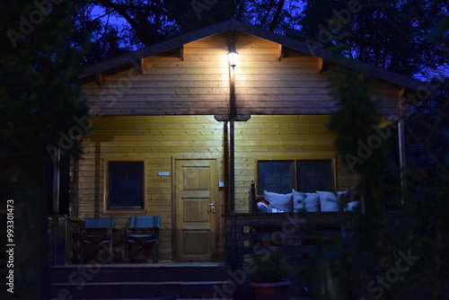 wooden House in the forest at Night