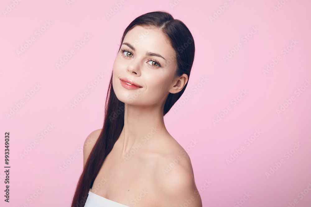 Beautiful young woman with long straight hair posing on pink background, with copy space Beautiful young woman with long straight hair posing on pink background, with copy space