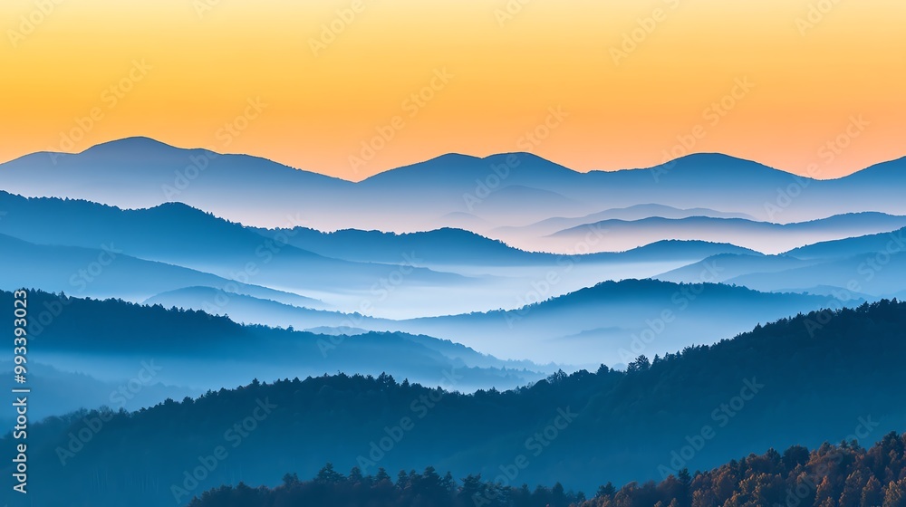 Misty mountains at sunrise with layered peaks and soft colors. Misty mountains at sunrise with layered peaks and soft colors.