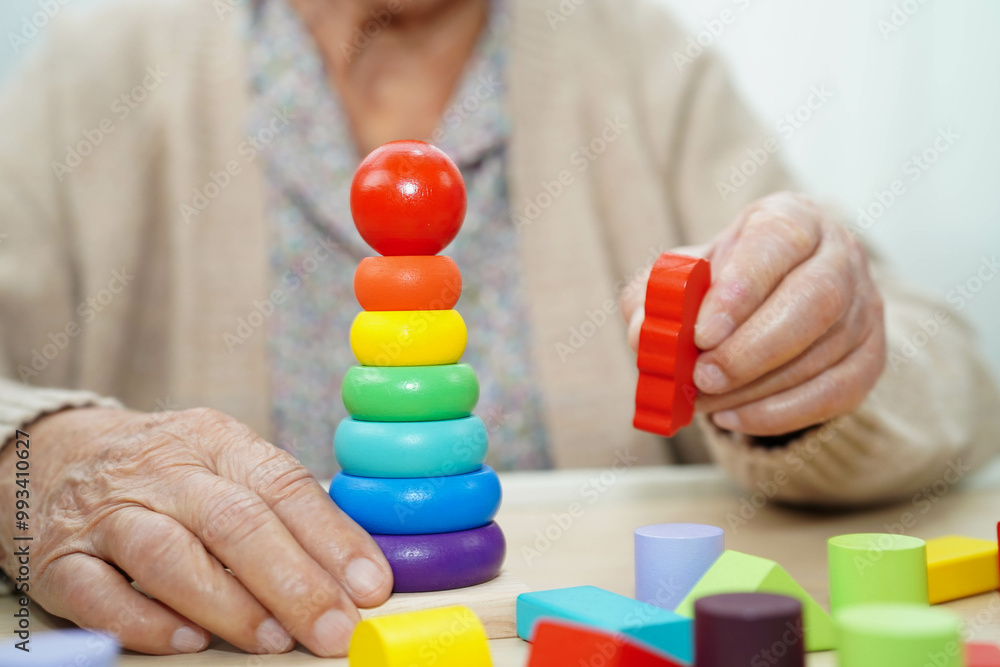 Asian elderly woman playing game. Asian elderly woman playing game.
