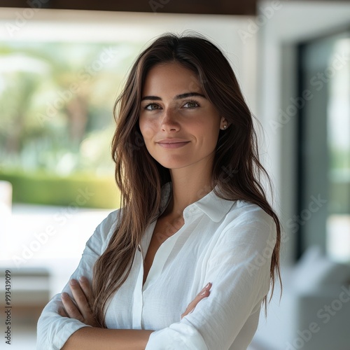 Real estate agent confidently standing in modern, light-filled home