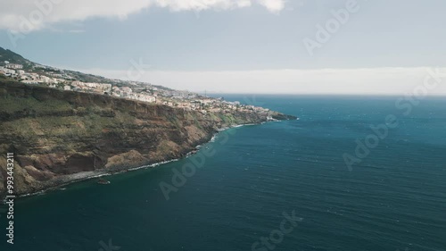 Rocky coastline of the Portuguese island of Madeira near Christo Rei, Canico. Drone aerial video.