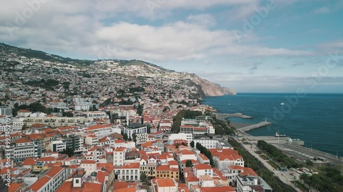 Funchal city aerial drone video with the Cathedral of Our Lady of the Assumption, Old Town of Funchal, Madeira Island, Portugal. Aerial drone view.