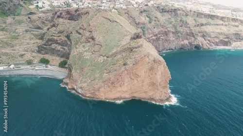 Peninsula with Christo Rei (Christ's Monument) on the Madeira Island near Canico, Portugal. Panorama of the bay. Aerial drone video.