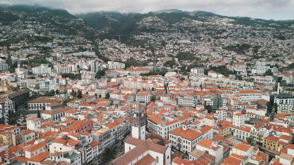 Funchal city aerial drone video with the Cathedral of Our Lady of the Assumption, Old Town of Funchal, Madeira Island, Portugal. Aerial drone view. Funchal city aerial drone video with the Cathedral of Our Lady of the Assumption, Old Town of Funchal, Madeira Island, Portugal. Aerial drone view.