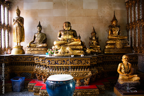 Ancient buddha in antique ubosot for thai people travelers visit respect praying blessing buddha and wish mystical holy deity angel at Wat Klang Bang Kaew at Nakhon Chai Si in Nakhon Pathom, Thailand photo