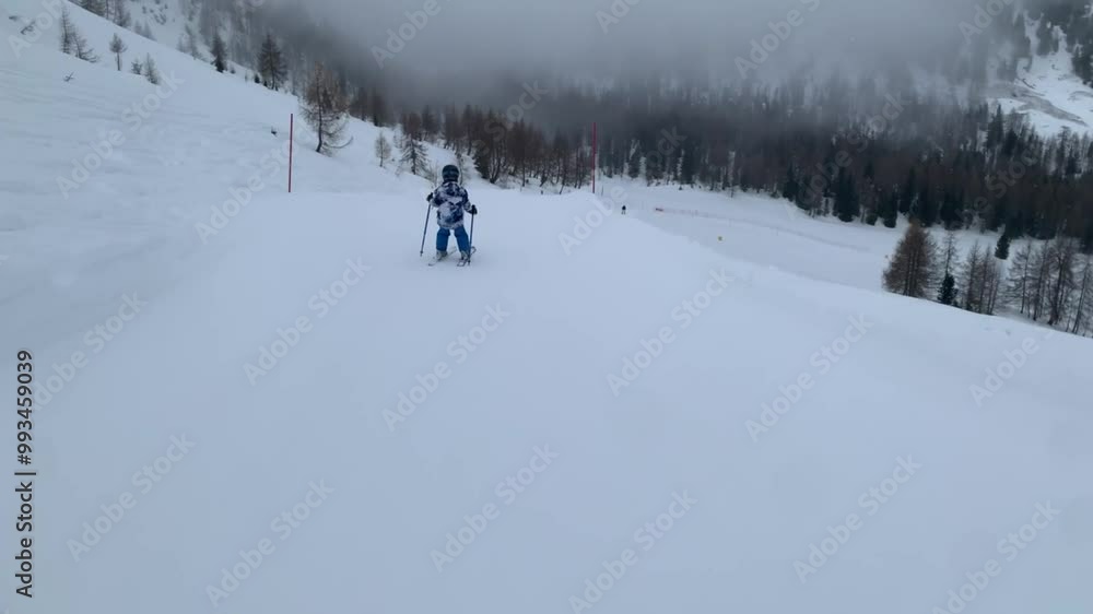 Children and adults, happy family in winter clothing at ski vacation, skiing, wintertime Children and adults, happy family in winter clothing at ski vacation, skiing, wintertime